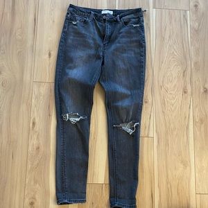 Distressed vervet black skinny jeans